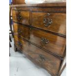 19th cent. Mahogany chest of 2 over 3 drawers on swept bracket supports. 34ins. x 16ins. x 31ins.