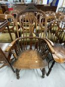 19th cent. Comb back carver chair with crinoline stretchers.