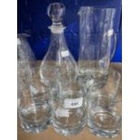 20th cent. Glass: Water set comprising tall jug, six glasses and decanter, all of plain form.