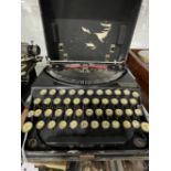 Typewriters: Early 20th cent. Remington portable black Japanned cased, handle A/F.