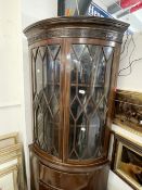 Late 19th cent. Mahogany glazed top bow front corner cupboard, the seventeen pane glass doors