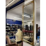 20th cent. Gilt bevel edged mirror. 20ins. x 54ins.