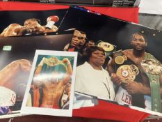 Boxing: Lennox Lewis, colour 23ins. x 19ins, and slightly smaller, 8ins. x 10ins (2), in fights,