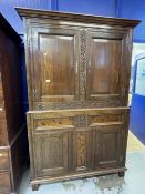 17th cent. Style oak cupboard with foliate carved stiles and inlaid bottom section, with stile feet.