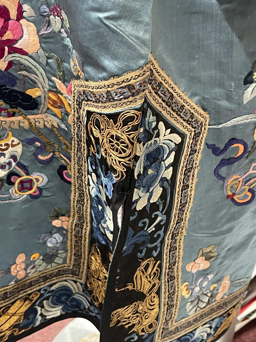 19th cent. Embroidered silk robe decorated with floral sprays and baskets of flowers on a light blue - Image 7 of 7