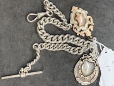 Silver watch Albert curb links and two fobs, one with 9ct gold inlay. Total weight 76.6g.