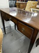 Early 19th cent. Mahogany small desk with three drawers, acanthus decoration on tapered supports.