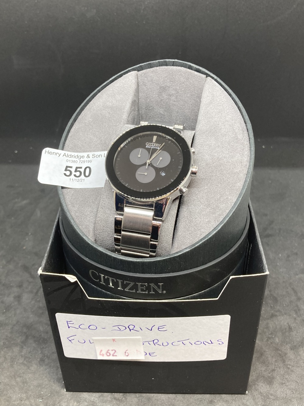 Watches: Citizen Axiom Eco-Drive wristwatch, box, papers and purchase receipt.