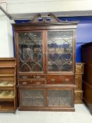 Large mahogany secretaire bookcase, the broken pediment top above a dental cornice above a frieze