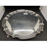 Hallmarked Silver: Salver on four scroll feet with Chippendale border. Hallmarked London. 12ins.