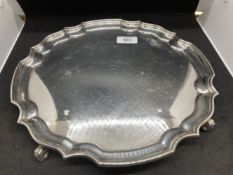 Hallmarked Silver: Salver on four scroll feet with Chippendale border. Hallmarked London. 12ins.