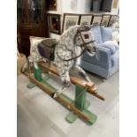 Toys/Hobbies: 1960s dapple grey rocking horse on green painted base. 54ins.