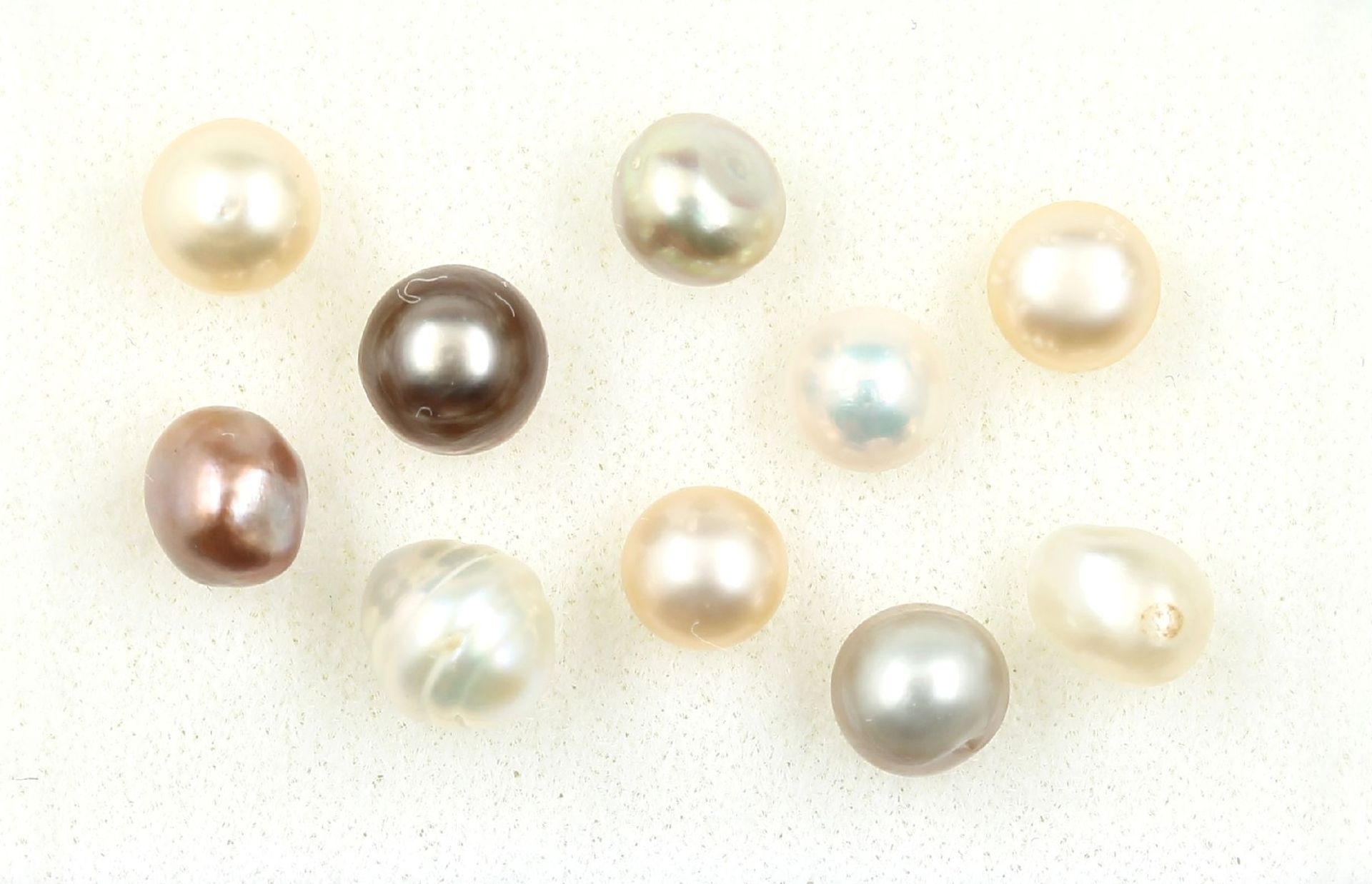 10 echte natürliche Perlen zus. ca. 15.87 ct, barock,
