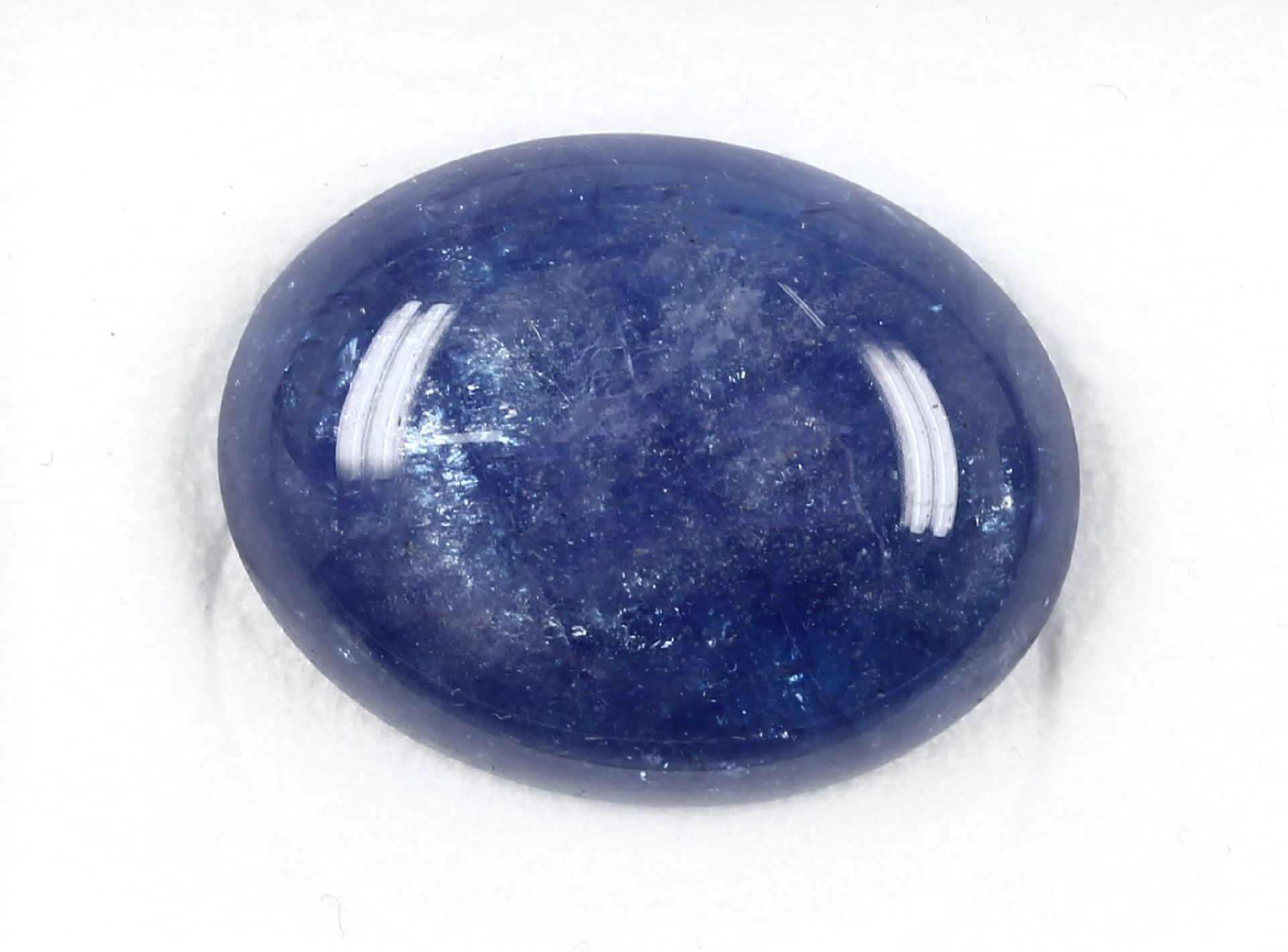 Loser ovaler Tansanitcabochon, 42.81 ct, ca. 28x21x7