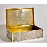 SILVER-GILT TROMPE L’OEIL CIGAR BOX, AFTER DESIGN OF TOBACCO COMPANY H. UPMANN WITH [...]