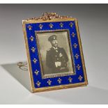 A FINE BELLE EPOQUE FABERGE BLUE GUILLOCHÉ ENAMEL AND 14K GOLD PHOTOGRAPH FRAME [...]