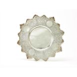 SILVER DECORATIVE DISH IN THE NEO-RUSSIAN STYLE WITH A CARVED EDGE AND FLORAL DECOR. [...]