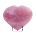 ROSE QUARTZ HEART-SHAPED SCULPTURESculpture carved out of a solid quartz rock. Resting on a metal