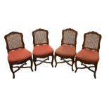SET OF 4 QUEEN CANE CHAIRS France, Louis XV periodWith scalloped wood backs resting on arched legs