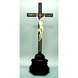 18TH CENTURY CRUCIFIX: A CARVED IVORY FIGURE OF CHRIST ON A CROSS INLAID WITH MOSAIC WOOD VENEER AND