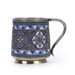 A SILVER mug with geometric and floral ornaments decorated with with floral motifs in polychrome