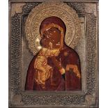 An icon in a brass oklad ‘Fyodorovskaya Virgin’ Central Russia, late 19th century Wood, gesso,