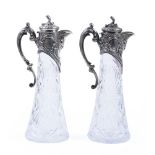 PAIR OF CARVED CRYSTAL WINE JUGS WITH FLORAL DECOR, CARTOUCHES AND ACANTHUS LEAVES Workshop of