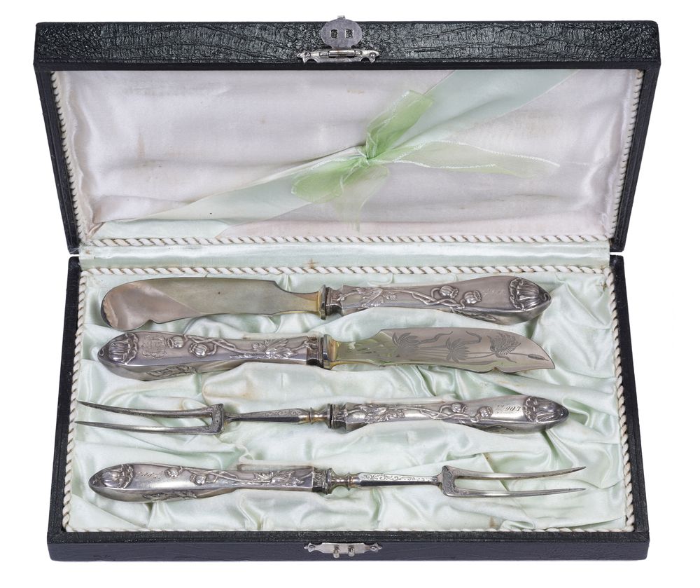 A set of cutlery for meat, handles are decorated with floral decor in the form of flowers and