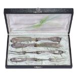 A set of cutlery for meat, handles are decorated with floral decor in the form of flowers and