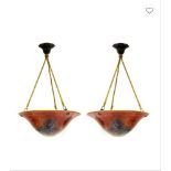 PAIR OF ART NOUVEAU-STYLE HANGING CEILING LAMPS red-orange glass, yellow interior, supported by