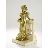 ERNEST WANTE (1872-1960) Gilded bronze female figure leaning on a marble balcony signed ‘E. Wante’