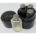 A SUITE OF FOUR JANE DERVAL ART DECO SILVER-MOUNTED SCENT BOTTLES WITH SILVER STOPPERS Four