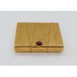 CARTIER GOLD CIGARETTE CASE, 1940s Yellow 18k gold Cartier case set with one cabochon ruby