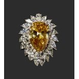 PLATINUM FANCY DEEP BROWN-YELLOW DIAMOND AND DIAMOND RING (GIA CERTIFICATE) Platinum ring set with a