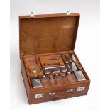 CARTIER RARE ANTIQUE TRAVEL silver KIT IN A LEATHER SUITCASE comprising silver travel toiletries: