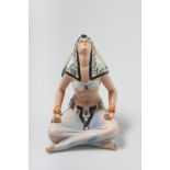 MEDITATING CERAMIC FIGURINE Ceramic, with polychrome glazes Signed on the underside Height: 20cm