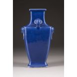 A BLUE-GLAZED HANDLED VASE