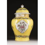 A YELLOW-GROUND FAMILLE ROSE JAR AND COVER