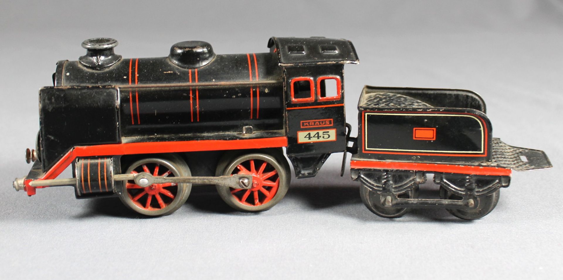 1 alte Dampflokomotive mit Uhrwerk, Funktion nicht geprüft, schwarz lithographiert, mit
