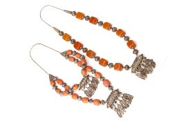 TWO BEDOUIN WHITE METAL AND AMBER COLOURED BEAD NECKLACES
