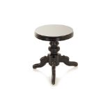 AN EBONISED TRIPOD PIANO STOOL