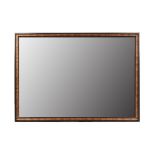 A LARGE RECTANGULAR WALL MIRROR