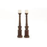 A PAIR OF LARGE TURNED AND CARVED WOOD PRICKET CANDLESTICKS