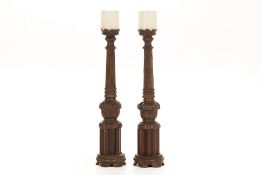 A PAIR OF LARGE TURNED AND CARVED WOOD PRICKET CANDLESTICKS