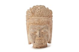 A CARVED STONE BODHISATTVA HEAD