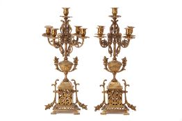 A PAIR OF GILT BRASS FIVE-LIGHT CANDELABRA