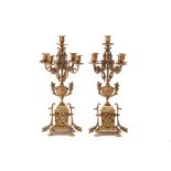 A PAIR OF GILT BRASS FIVE-LIGHT CANDELABRA