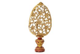 A SOUTHEAST ASIAN GILTWOOD LEAF SHAPED CARVING