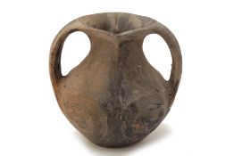 A NEOLITHIC STYLE TWIN HANDLED POTTERY JAR