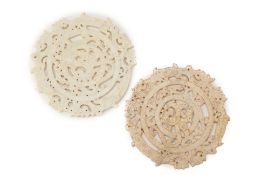 TWO SIMILAR CARVED AND PIERCED DISCS